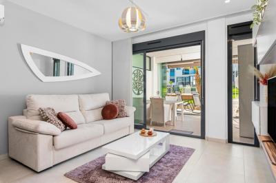 Apartamento en planta baja en Oasis Beach Punta Prima 9 Nº 035 in España Casas